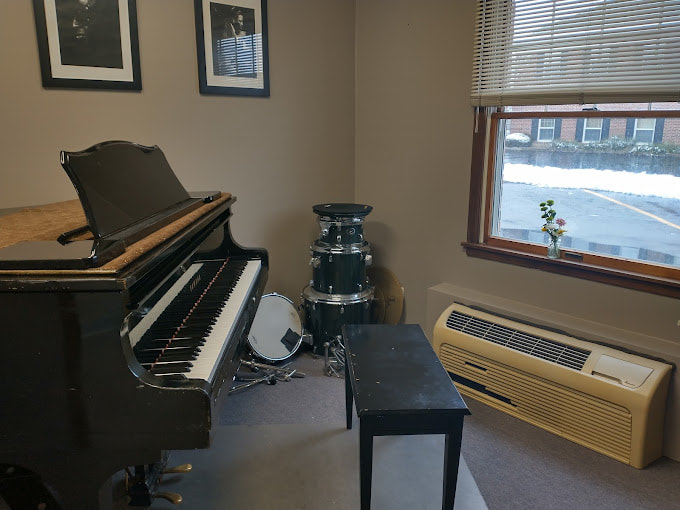 Student playing Yamaha Grand Piano at Tritone Music School